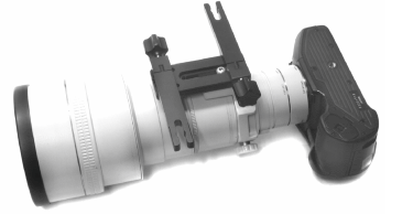 Underside of camera with long lens on Arca-Swiss compatible lens plate stabilized with 2 Wimberley M-1 Quick Release Arms